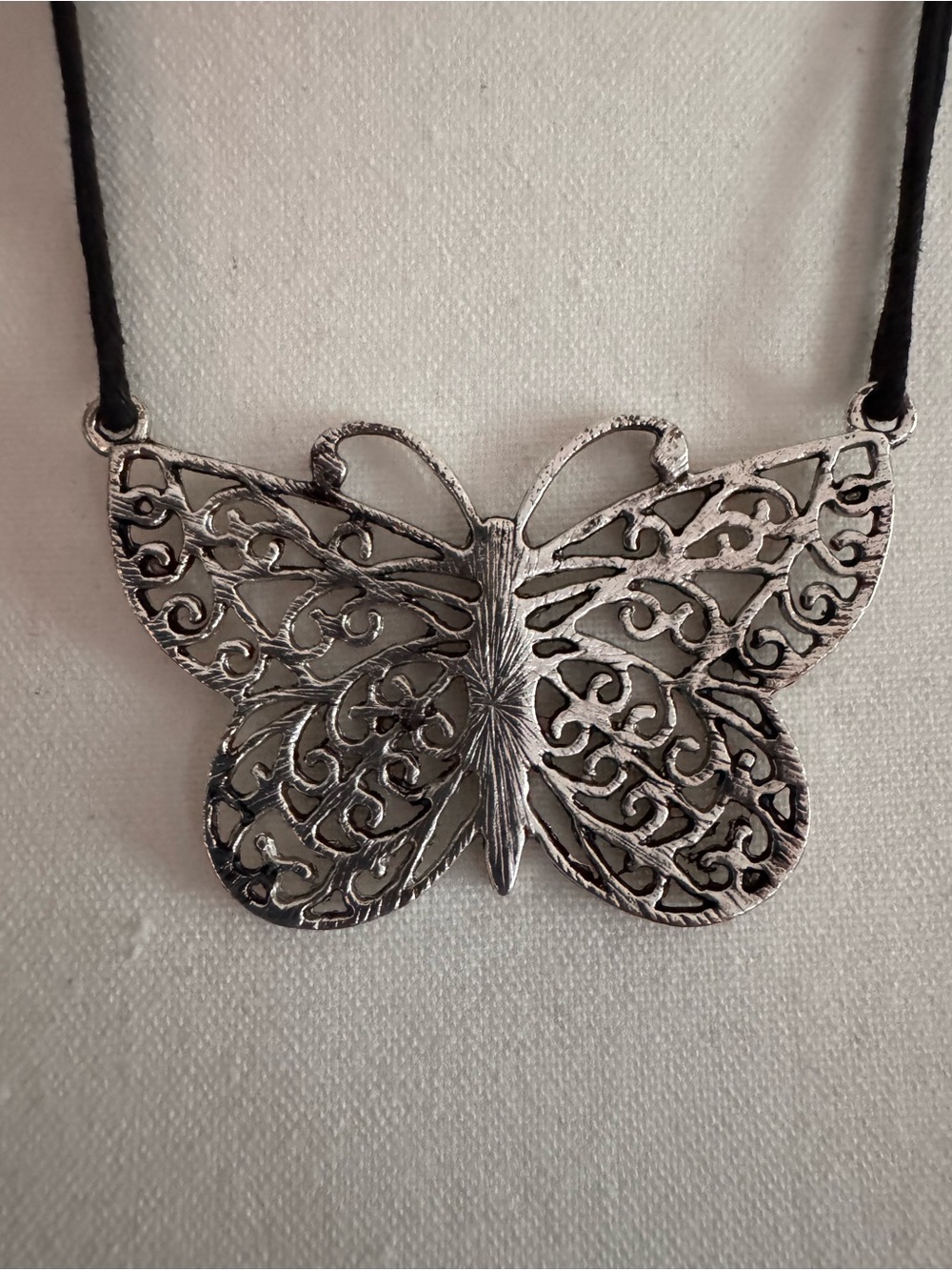 Necklace - Silver Tone Butterfly Charm Pendant with Faux Suede Black Cord